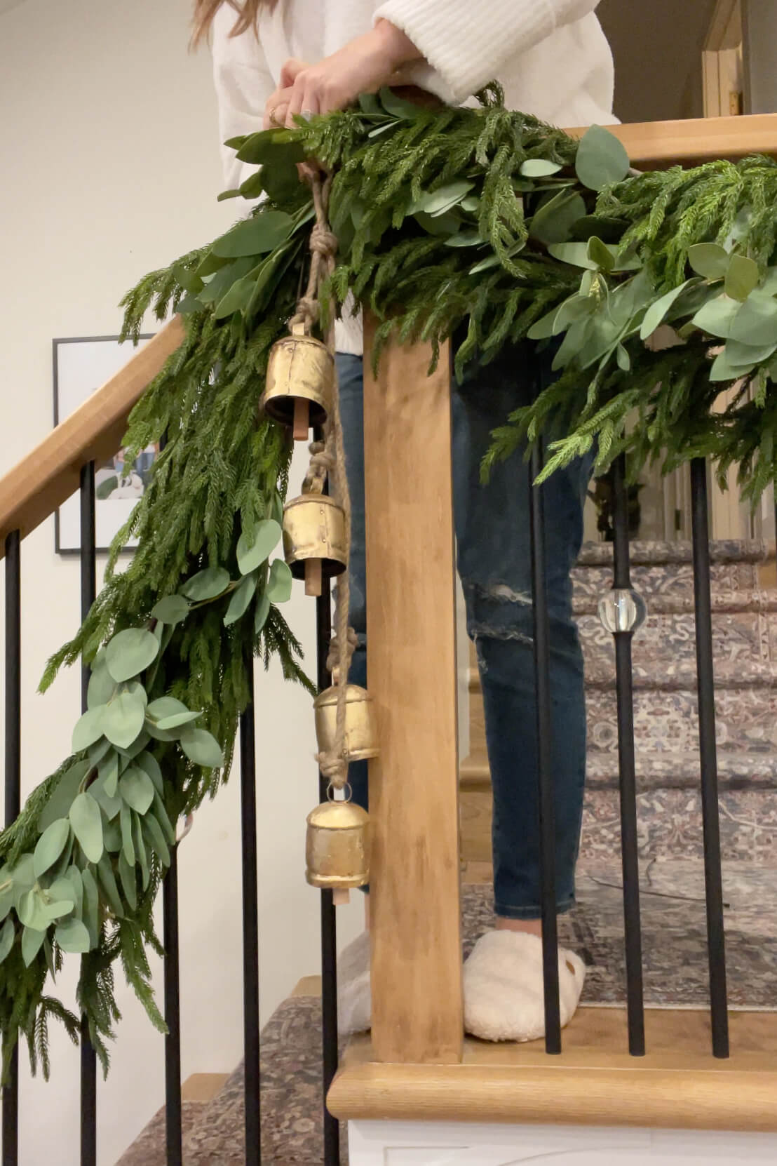 Using bells in Christmas decor on a staircase.